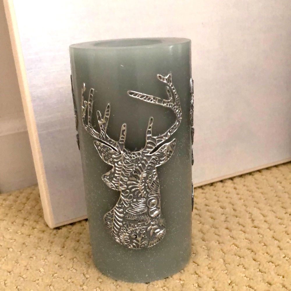 Pier 1 candle deer motif. Unused. Grey, blue, silver. 3” wide, 6” high